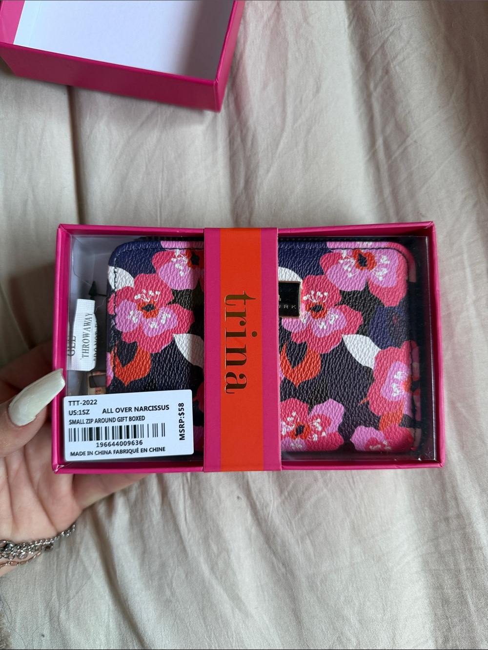 Trina Turk Pink Floral Zip-Around Wallet with Black Background